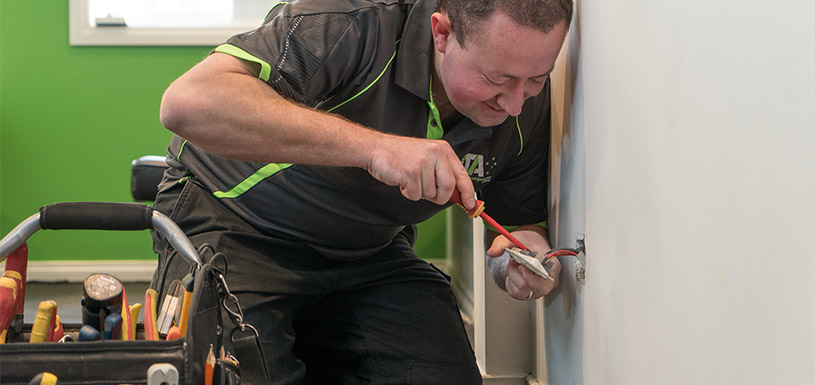 Technician fixing wiring
