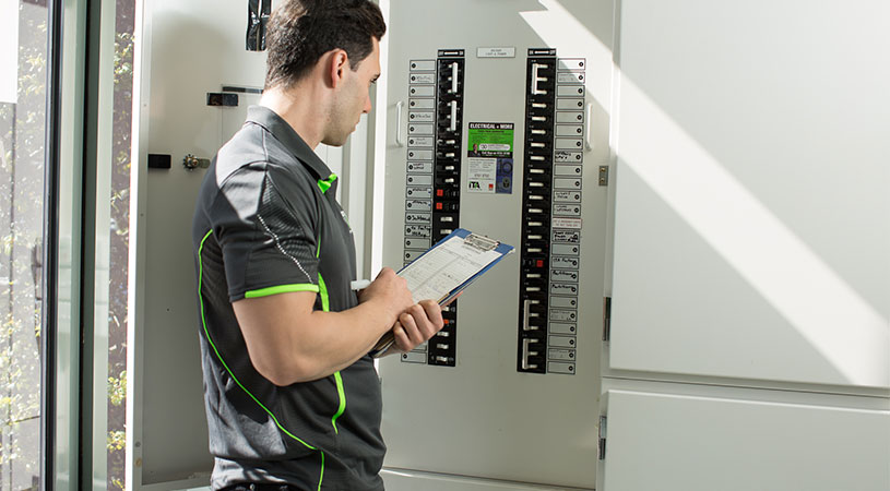 ita electrician inspecting circuits